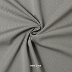 A swatch of knit pique fabric in a grey color, showing the texture and weave of the material.