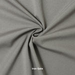 A swatch of knit pique fabric in a grey color, showing the texture and weave of the material.