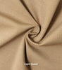 A swatch of knit pique fabric in a light camel color, showing the texture and weave of the material.
