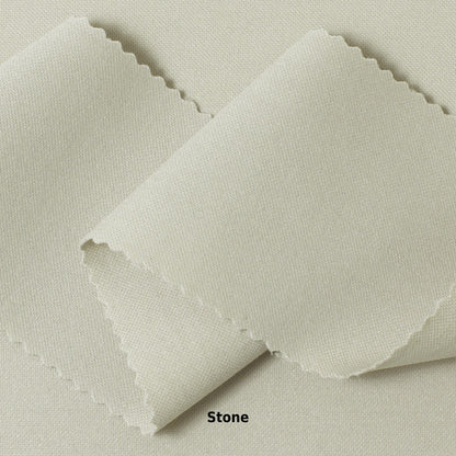 A swatch of knit pique fabric in a light beige color, showing the texture and weave of the material.